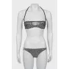 Swimsuit in branded print with tag