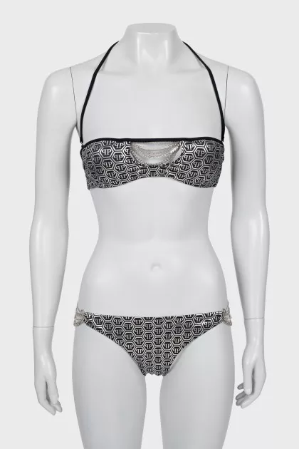 Swimsuit in branded print with tag