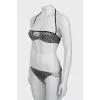 Swimsuit in branded print with tag