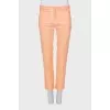 Orange trousers with patch pockets