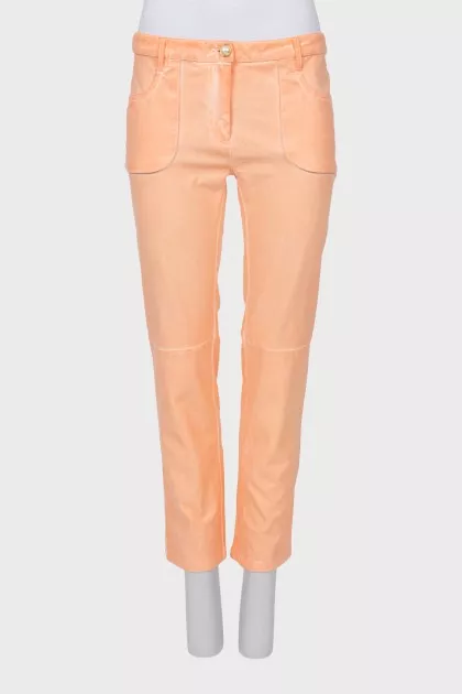 Orange trousers with patch pockets
