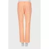 Orange trousers with patch pockets