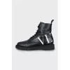 Leather boots with text print