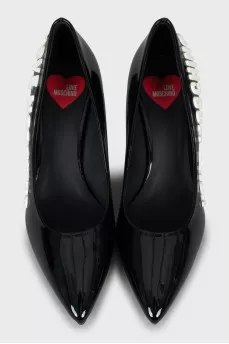Patent leather shoes with embossed logo