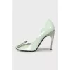 Patent leather shoes with metal heels