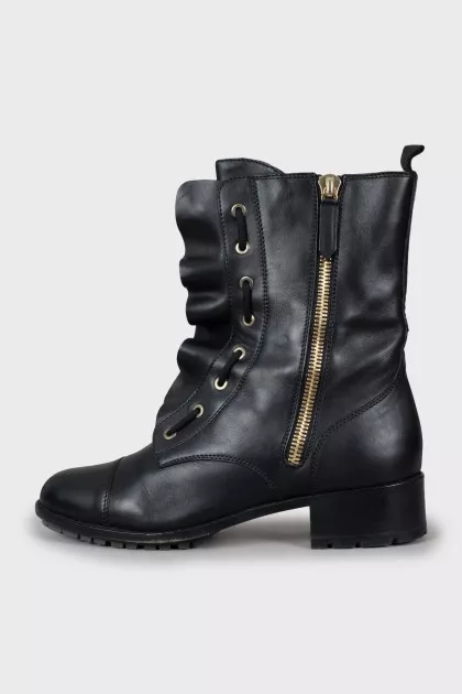 Leather boots decorated with frills