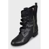 Leather boots decorated with frills