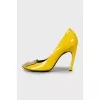 Yellow patent leather shoes