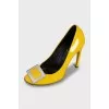 Yellow patent leather shoes