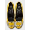 Yellow patent leather shoes