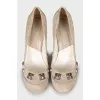 Suede shoes decorated with rhinestones