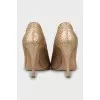 Gold-tone snakeskin shoes