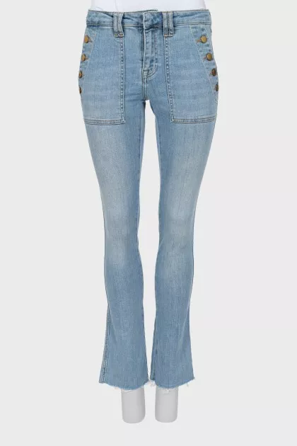 Flared jeans with gold buttons