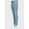Flared jeans with gold buttons
