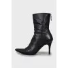 Black leather ankle boots with pointed toe