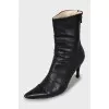 Black leather ankle boots with pointed toe