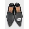 Black leather ankle boots with pointed toe