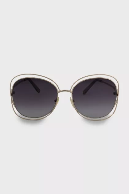 Sunglasses with gold frame and temples