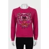 Pink sweatshirt with signature print