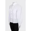 Shirt with perforation and voluminous sleeves