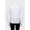 Shirt with perforation and voluminous sleeves
