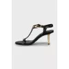 Leather sandals with golden stiletto heels