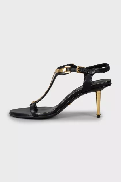 Leather sandals with golden stiletto heels
