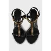 Leather sandals with golden stiletto heels