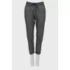 Trousers with printed pattern and raised seams