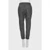 Trousers with printed pattern and raised seams