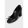 Leather shoes decorated with bows