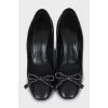 Leather shoes decorated with bows