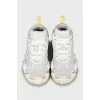 White sneakers with a textured sole