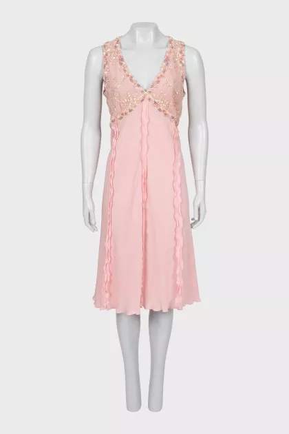Dress decorated with beads and frills