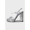 Silver sandals with heel decoration
