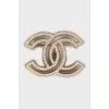 Golden brooch decorated with rhinestones