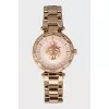 Golden watch with rhinestones on the dial