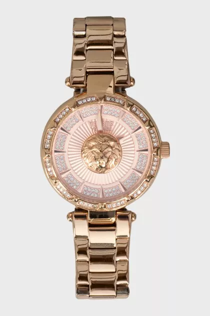 Golden watch with rhinestones on the dial