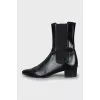 Black ankle boots with textile inserts