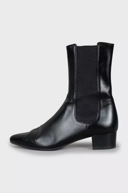 Black ankle boots with textile inserts