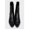 Black ankle boots with textile inserts
