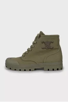 Green boots with brand logo