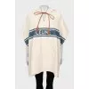 Cape with hood and branded logo