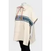 Cape with hood and branded logo