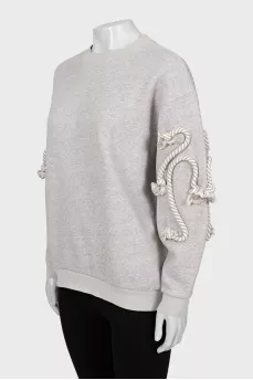 Gray sweatshirt with sleeve decoration