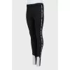 Black trousers with stripes and stirrups