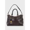Leather tote bag with metal decor