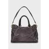 Leather tote bag with metal decor