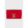 Patent leather clutch with gold logo