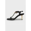 Leather sandals with golden heels